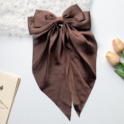 Large elegant bow, long flowing ribbon, simple but effective spring clip hairpin