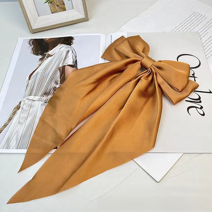 Large elegant bow, long flowing ribbon, simple but effective spring clip hairpin