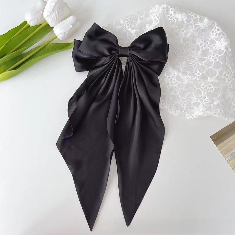 Large elegant bow, long flowing ribbon, simple but effective spring clip hairpin