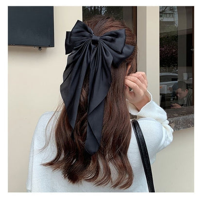 Large elegant bow, long flowing ribbon, simple but effective spring clip hairpin