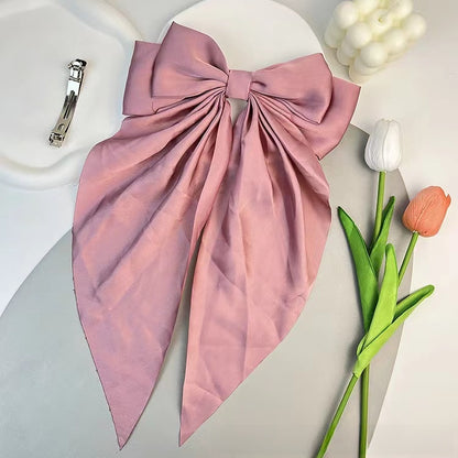 Large elegant bow, long flowing ribbon, simple but effective spring clip hairpin