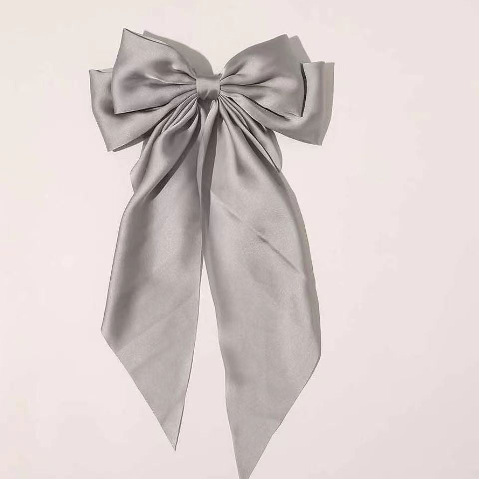 Large elegant bow, long flowing ribbon, simple but effective spring clip hairpin