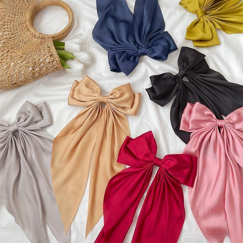 Large elegant bow, long flowing ribbon, simple but effective spring clip hairpin