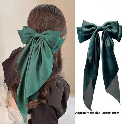 Large elegant bow, long flowing ribbon, simple but effective spring clip hairpin